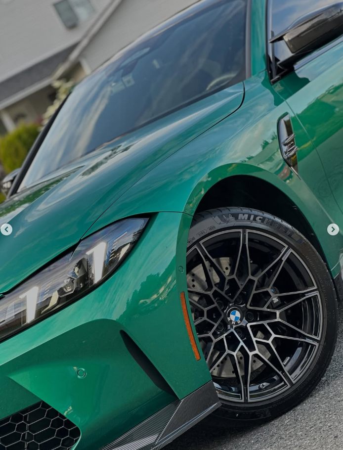 Detail work 1, green BMW wheel and paint close up